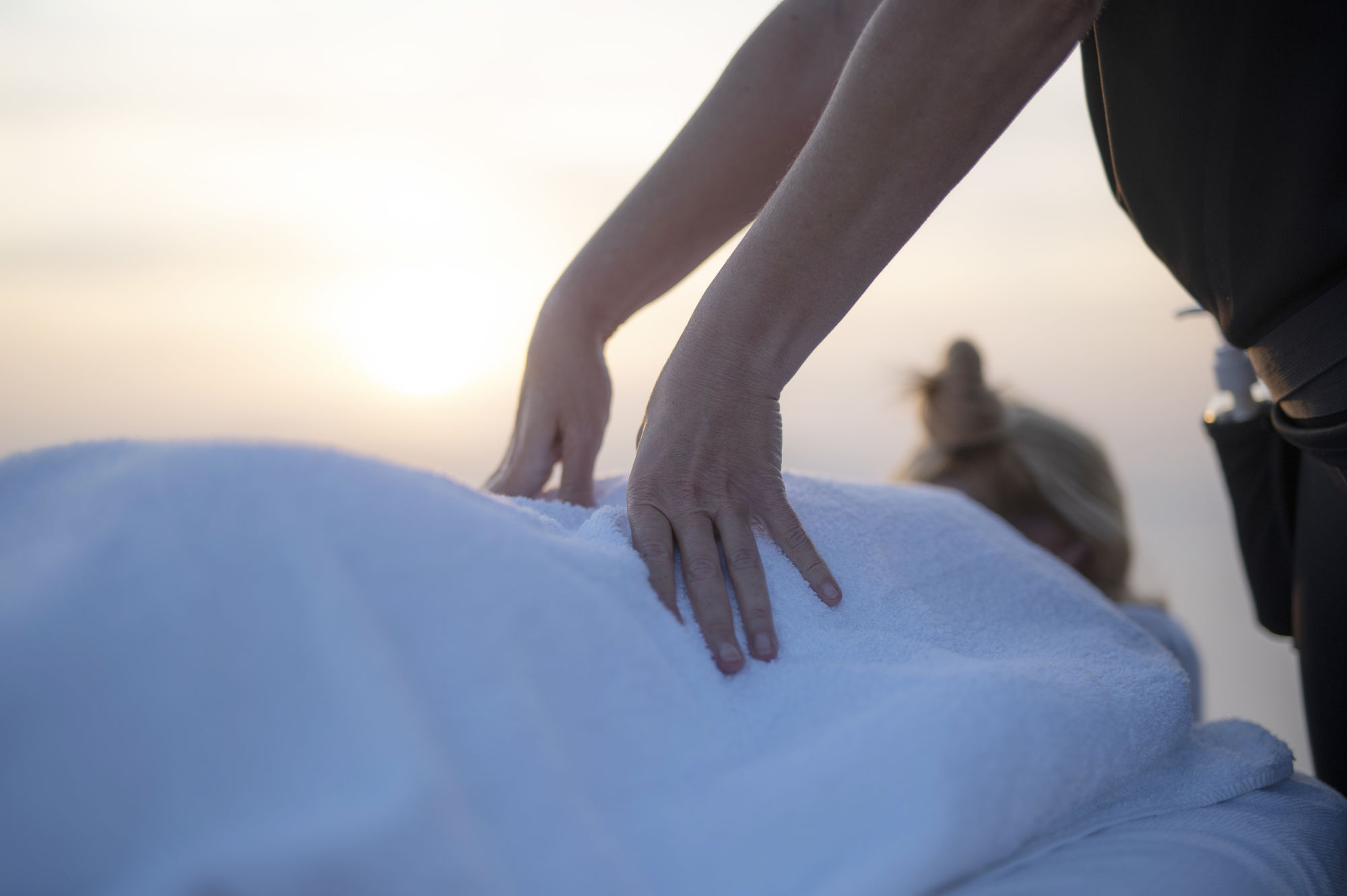 Enhance your well-being with acupressure therapy as expert hands apply precise pressure to key points on the body. Serene image capturing the essence of acupressure, promoting relaxation and holistic health in Santorini.
