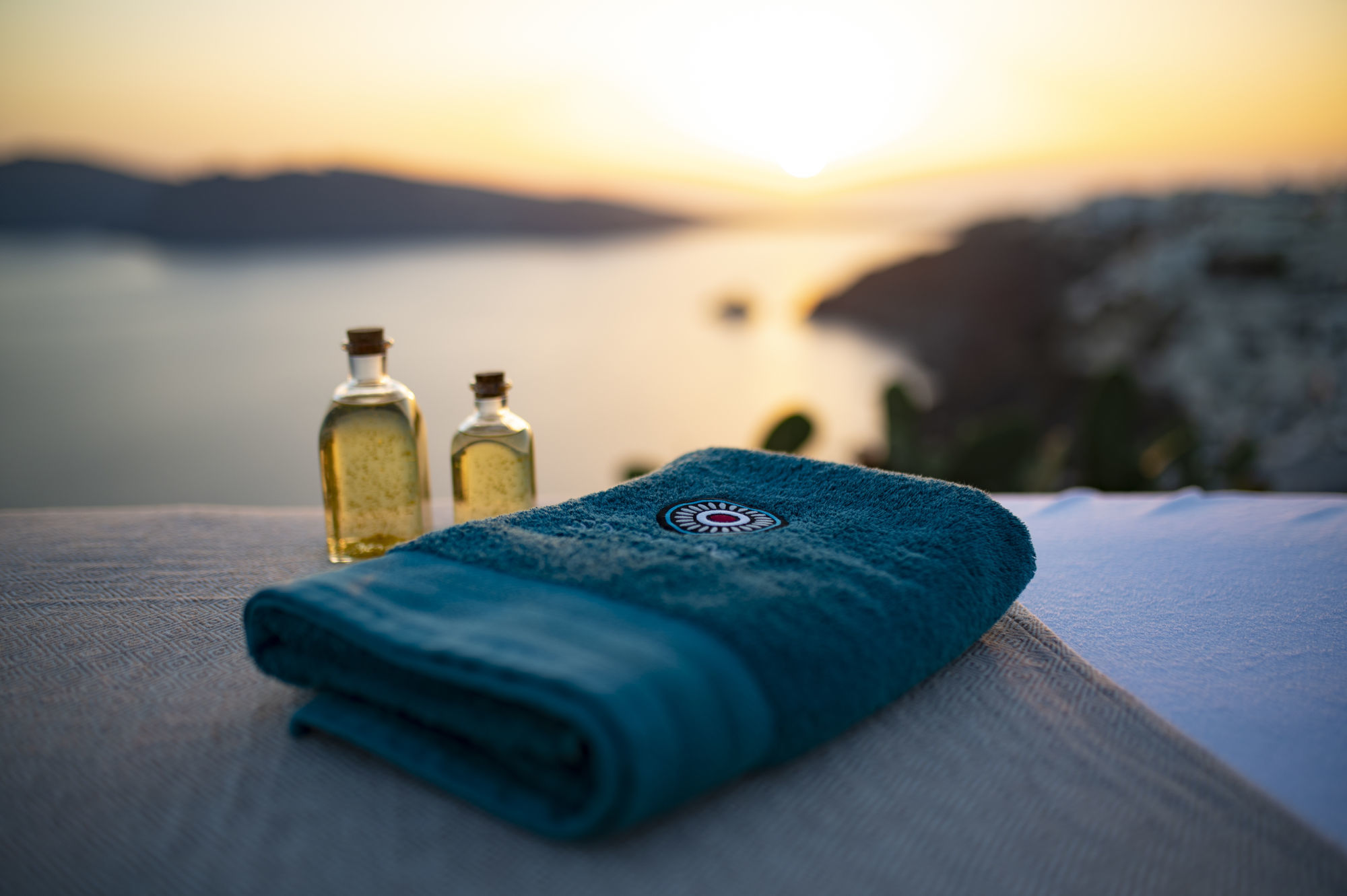 Santorini Mobile Massage: Awaits, with Signature Massage Treatment in Santorini, Oia Sunset in the Background